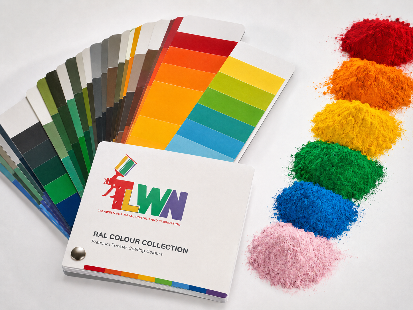 Fan of powder coating colour sample panels on a dark steel table